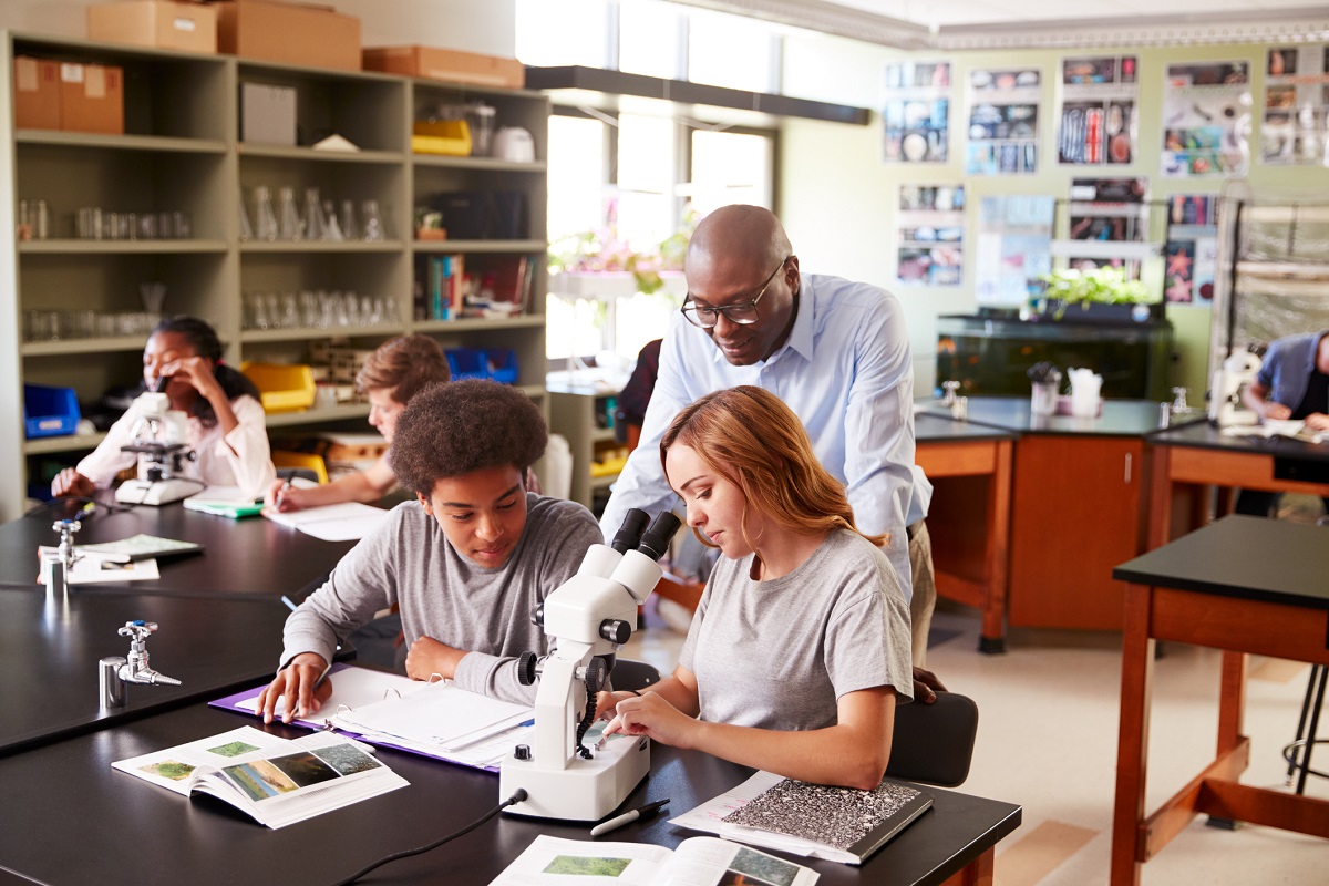 teacher and students in science classroom
