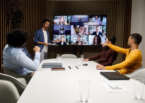 Virtual office meeting with people around a conference table