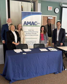 conference photo featuring MSG staff and the table