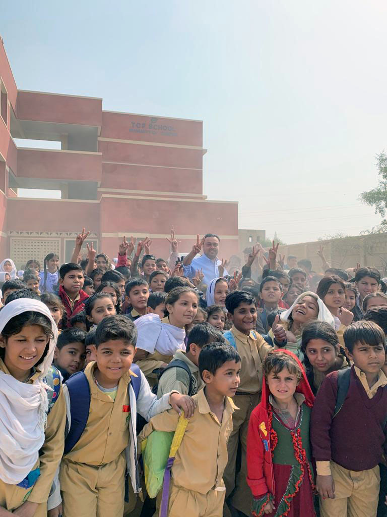 Shezad Habib with group of students in Pakistan