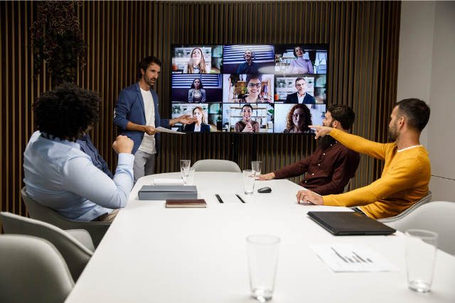 Virtual office meeting with people around a conference table