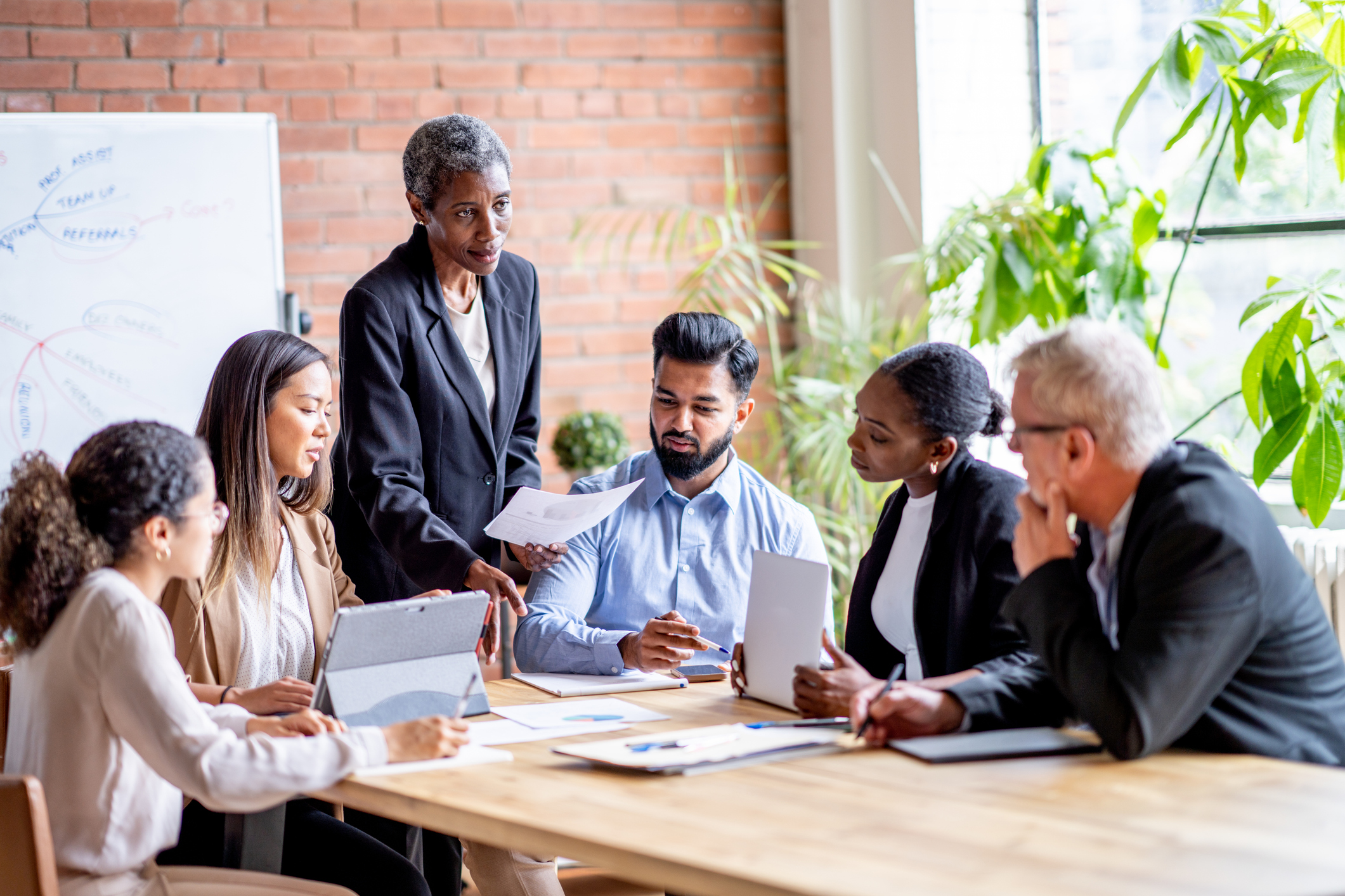 Group of people around a conference room table