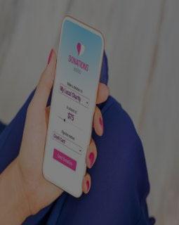 Woman donating money by using phone