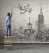 boy on ladder drawing airplane on skyline