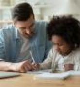 Dad helps daughter with homework