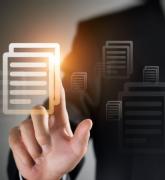 Hand points to lighted icon of a document on a screen