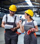 Two employees working in a factory setting