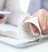 Young family man and woman checking financial figures