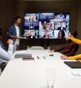 Virtual office meeting with people around a conference table