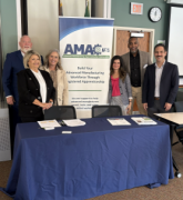 conference photo featuring MSG staff and the table